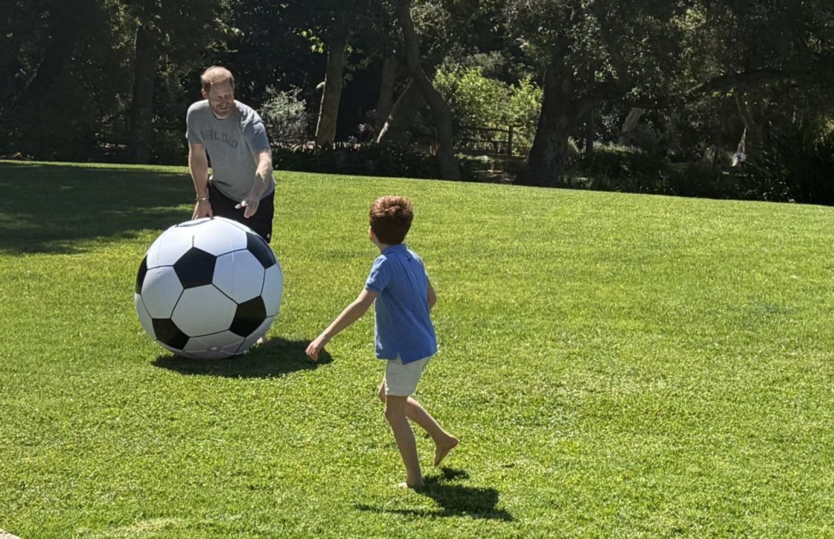 Harry of England plays with his son Archie