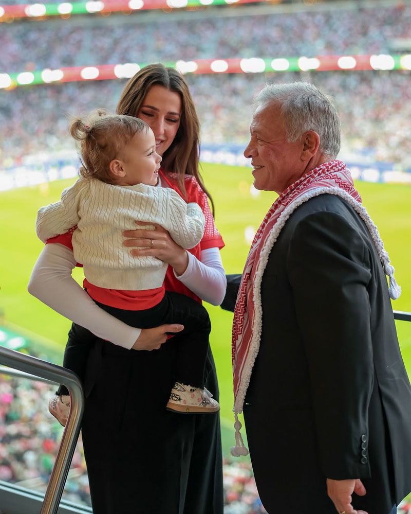 King Abdullah II, Chief Honorary Al Hussein bin Abdullah II and his Chief Consort Rajwa Al Hussein, accompanied by their daughter, are at the San Francisco stadium cheering for their team against Algeria (Instagram)